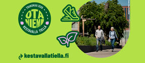 Text 'Otaniemi on a sustainable path' and image of two people walking on campus.