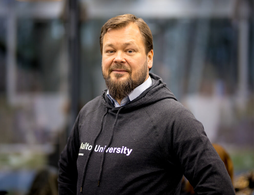Ville Jokela Aalto CRE Managing Director smiling to the camera, wearing Aalto University hoodie. Pic: Kalle Kataila / Aalto University