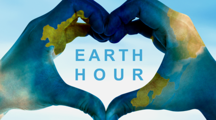 Kädet muodostavat sydämen keskellä teksti Earth Hour